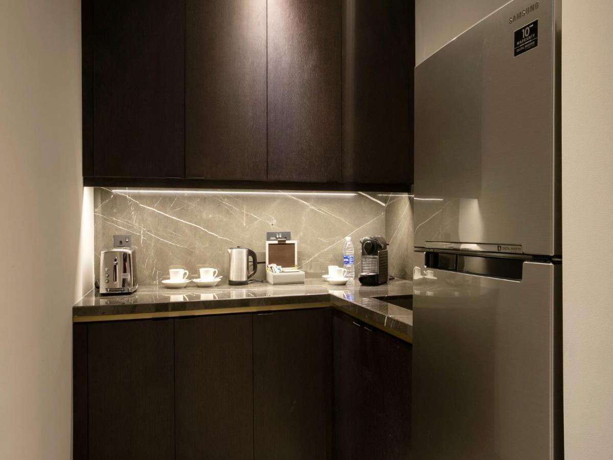 Hyatt Regency Al Kout Mall Kuwait City Exteriör bild A kitchen in a hotel room